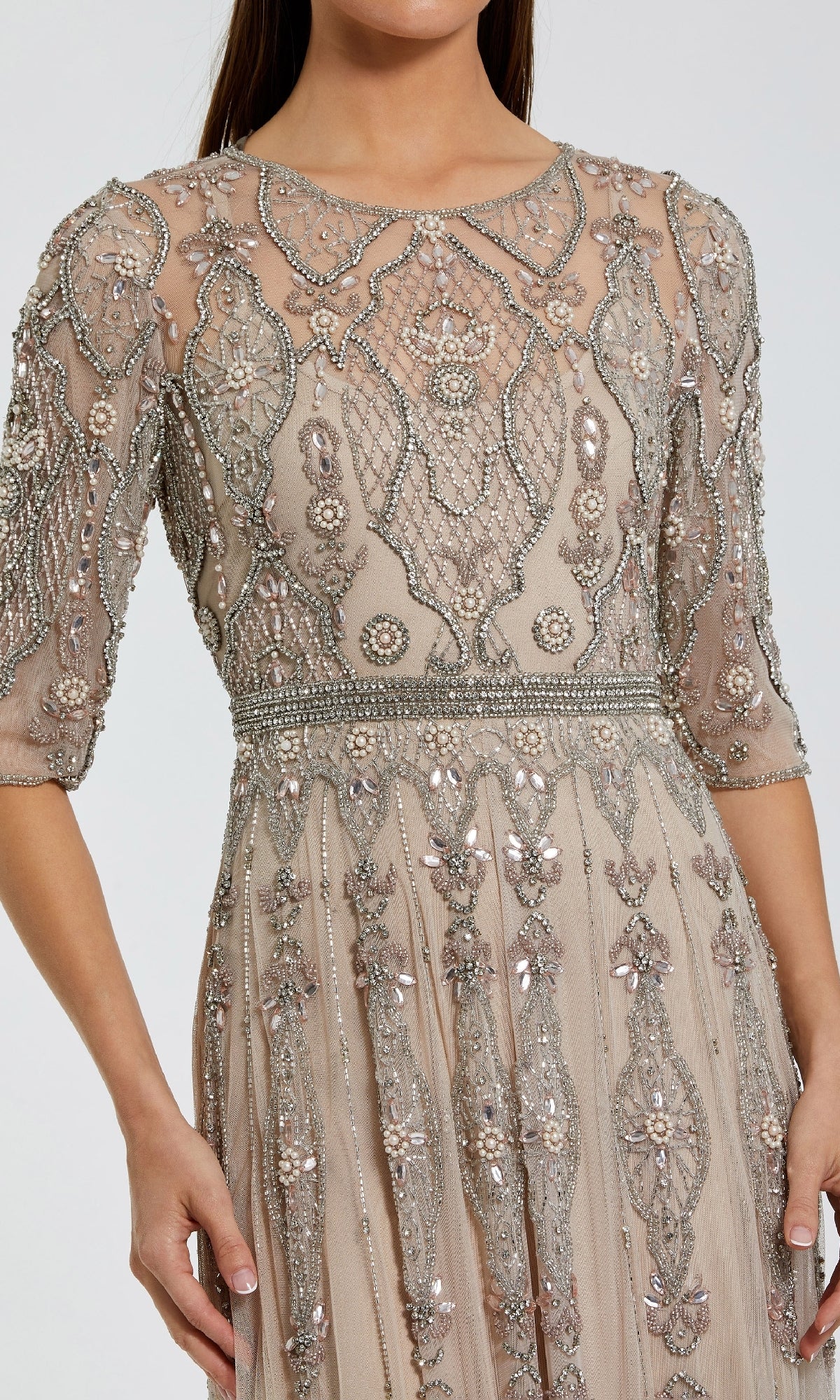 A woman wearing the Hand-Beaded Lilac Formal Dress Mac Duggal 10115, featuring intricate beadwork, sequin embellishments, and sheer sleeves, shown from shoulders to mid-thigh.